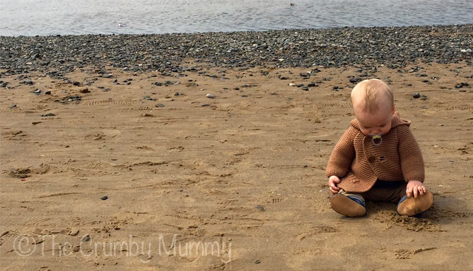 baby's first time on the beach