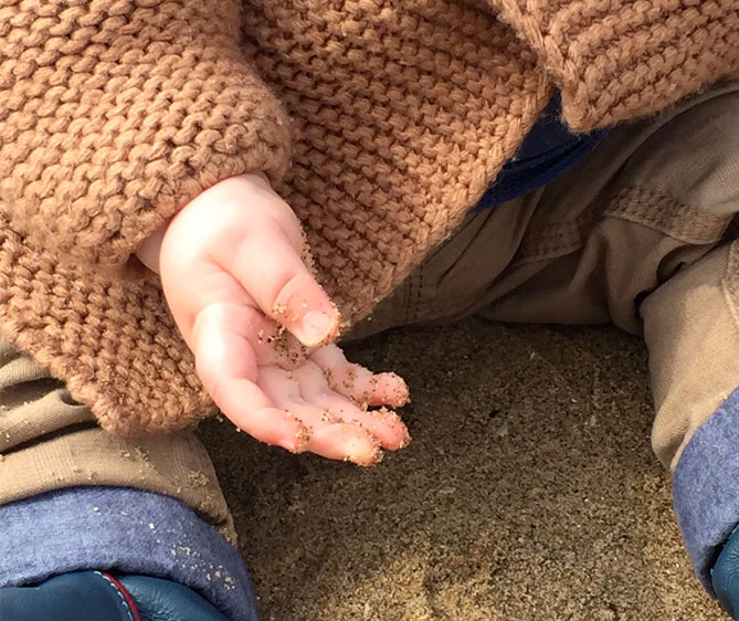 sandy baby hands