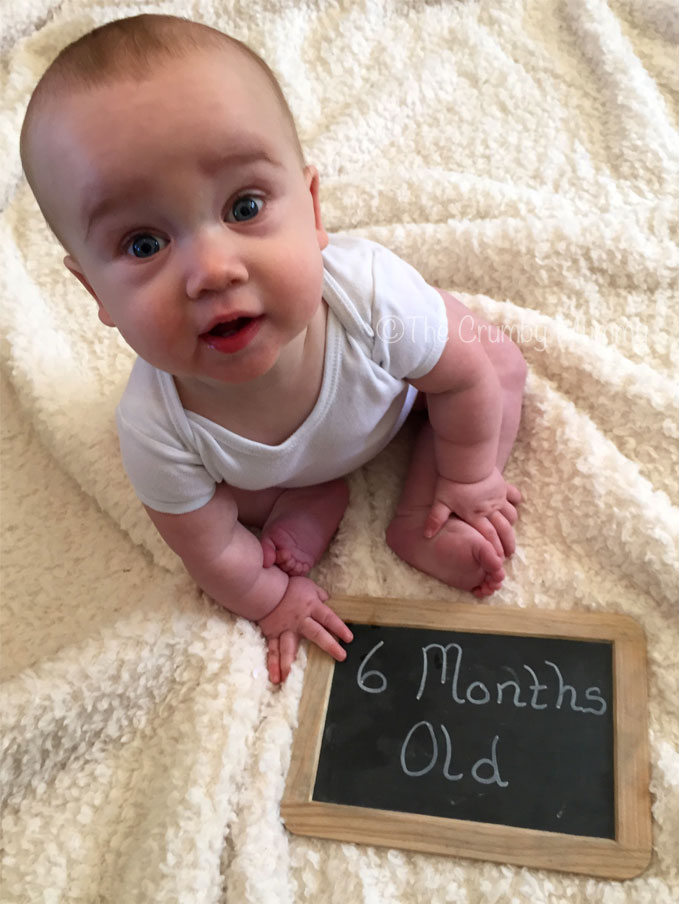 sitting up at six months old