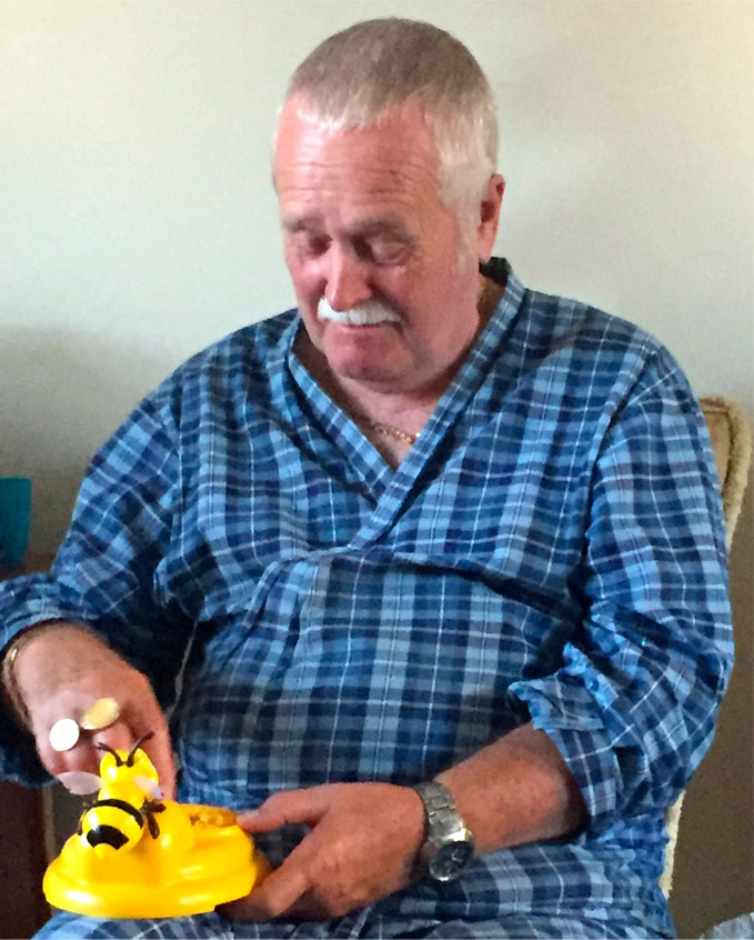 Grandad playing beehive surprise